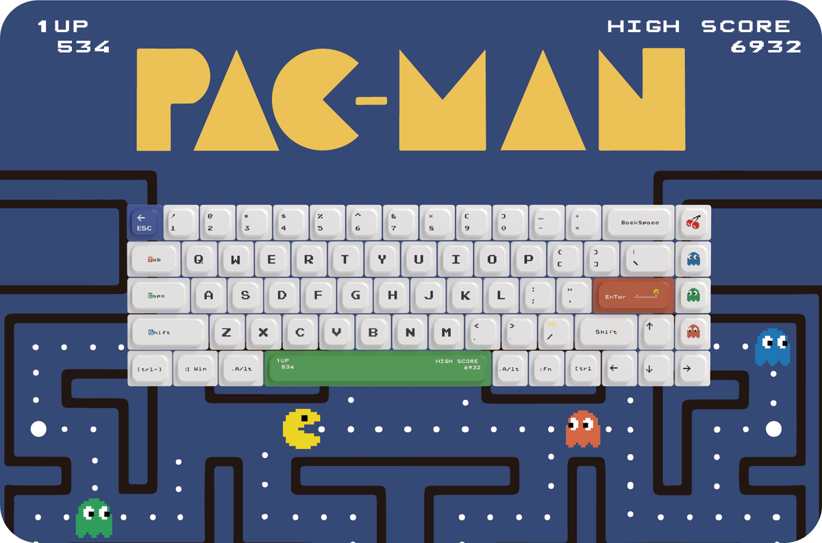 PAC keycaps arranged on an original blue arcade maze graphic