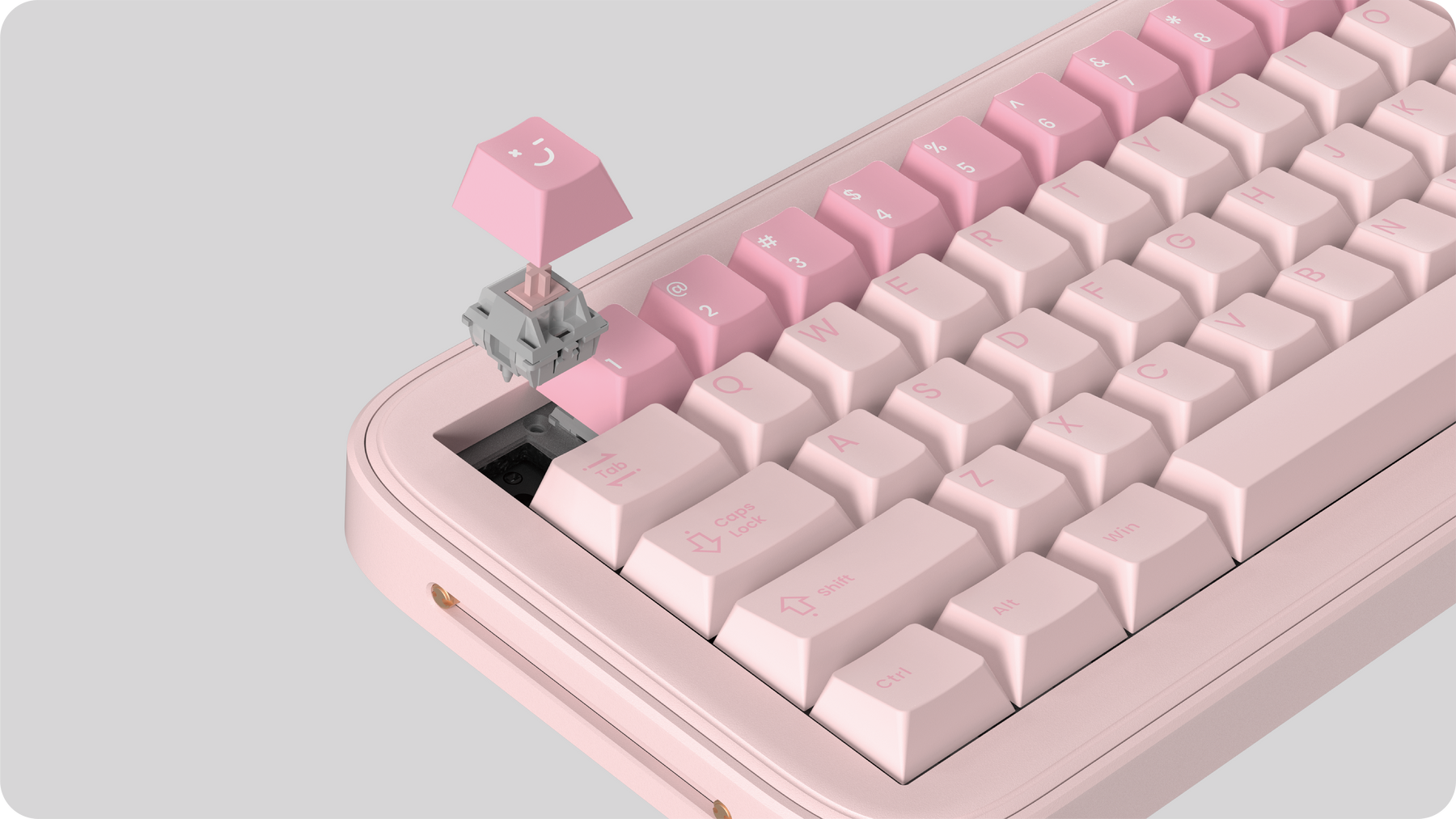 A keycap and switch being removed from the hot-swappable Spacetime 65 keyboard